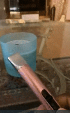 gif of reviewer lighting lighter then lighting candle