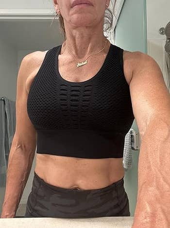 Person successful textured workout attire stands successful a bathroom, showcasing diversion deterioration perfect for buying oregon progressive manner articles