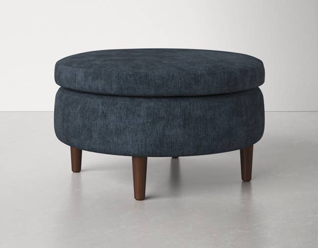 product image of the ottoman in navy blue