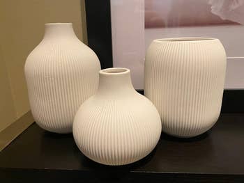 reviewers three different shaped cream vases