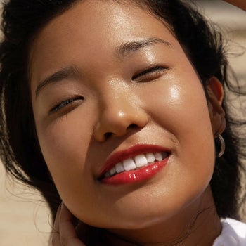 model wearing the lip gloss in the shade 