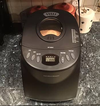 the automatic bread maker on a reviewer's kitchen counter