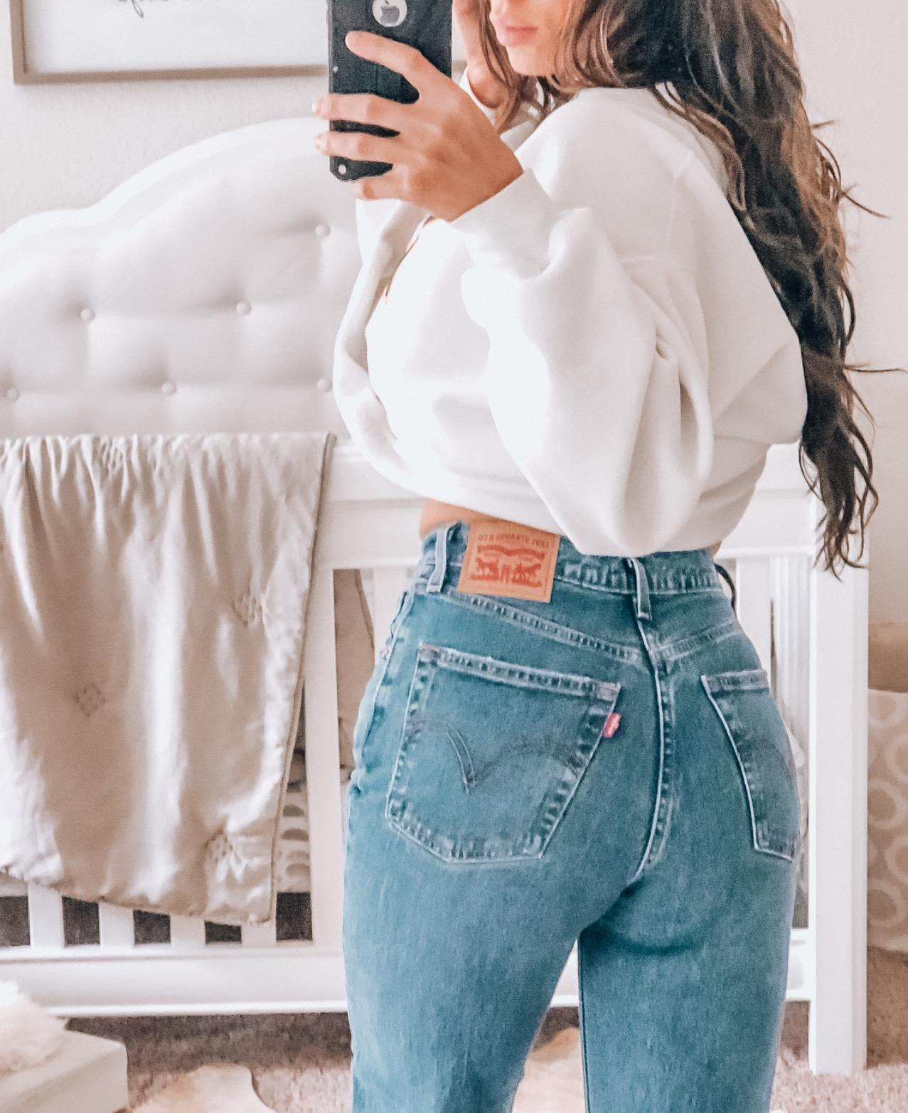 a different reviewer shows the back view of the blue jeans