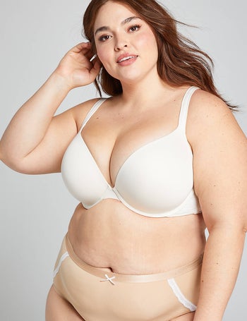front of a model wearing a white push-up bra