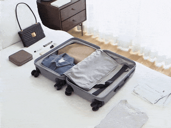 gif of things being packed into the suitcase