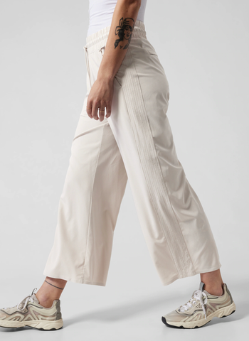 a different model wearing the pants in cream