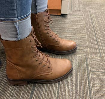 Reviewer wearing brown boots
