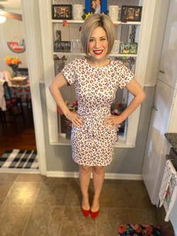reviewer wearing the dress in leopard print