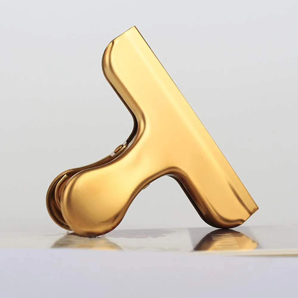 A shiny gold chip clip 