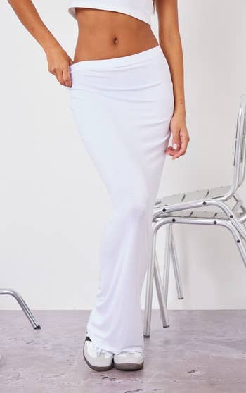 model wearing white maxi skirt