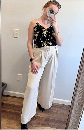 Reviewer in white high waisted wide leg pants 