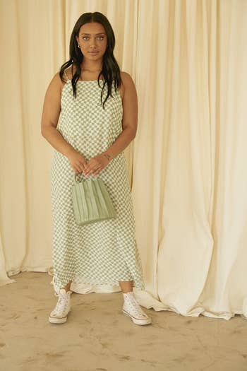 front view of model in checkered linen midi dress