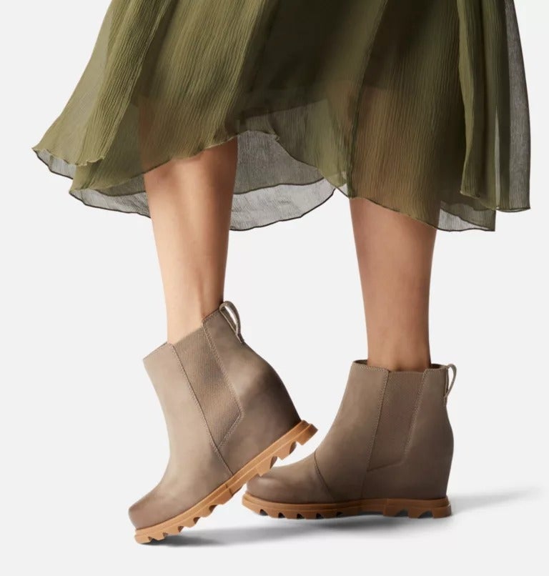 model wearing the boots in tan