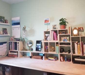 multiple of the adjustable shelves arranged on a reviewer's desk