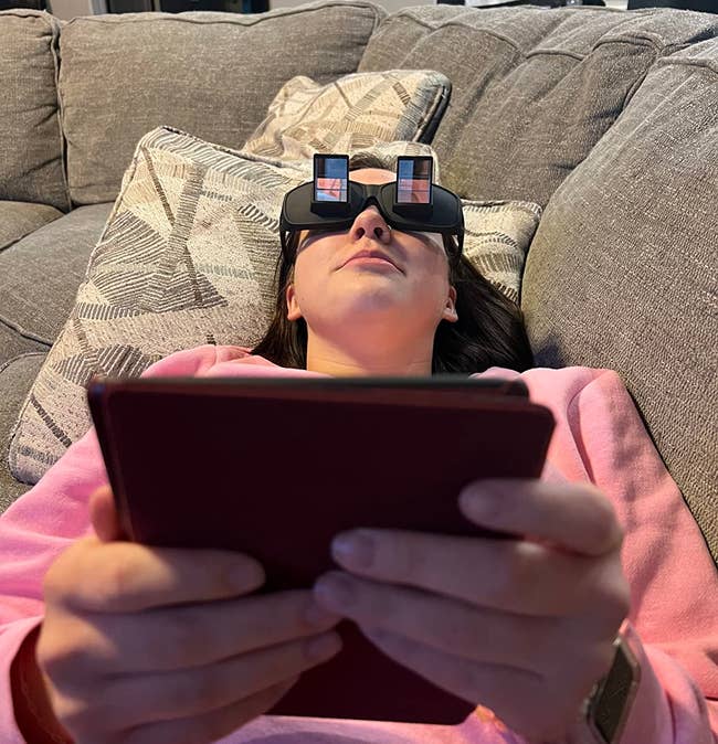 review laying on back and reading with the glasses