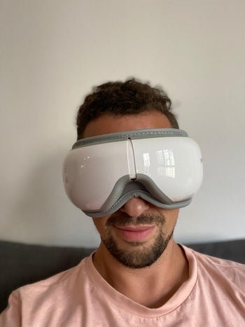 Reviewer wearing the eye massager