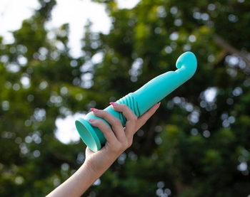Hand holding teal g-spot thrusting vibrator