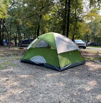 Reviewer photo of the tent in a white and green color