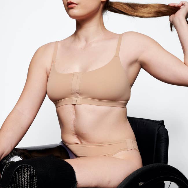 a model posing in the beige bra
