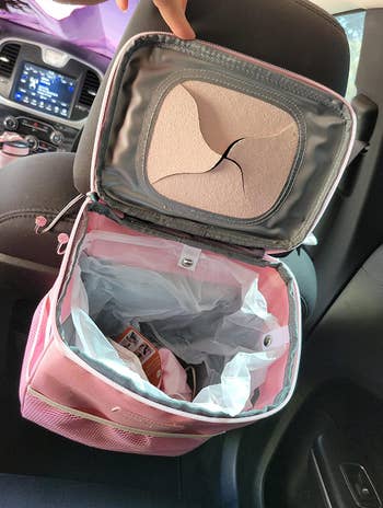 reviewer's car trash can opened