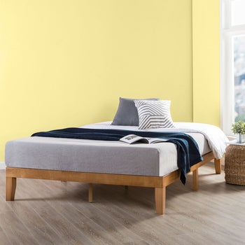 lifestyle photo of wooden low-profile twin bed frame