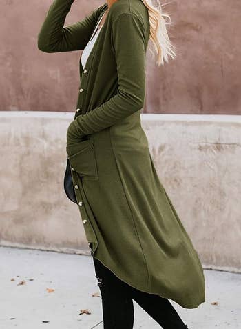 side view of model in olive longline cardigan