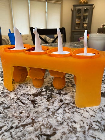 a reviewer photo of the four-mold stand