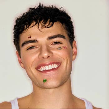 Smiling idiosyncratic   with impermanent  effect   tattoos connected  their face, wearing a casual vessel  top