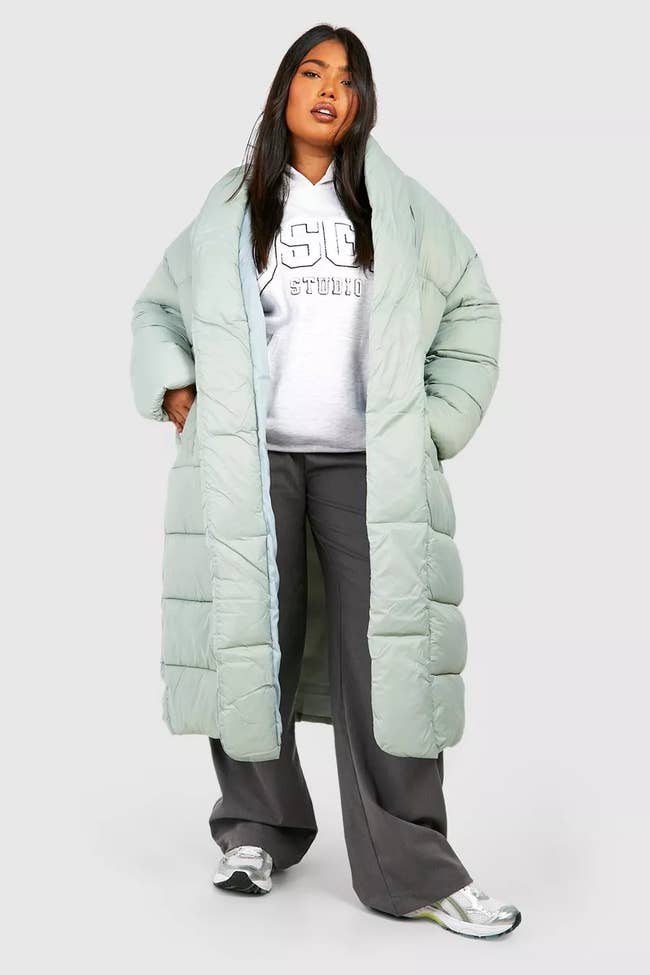 model in long puffer coat