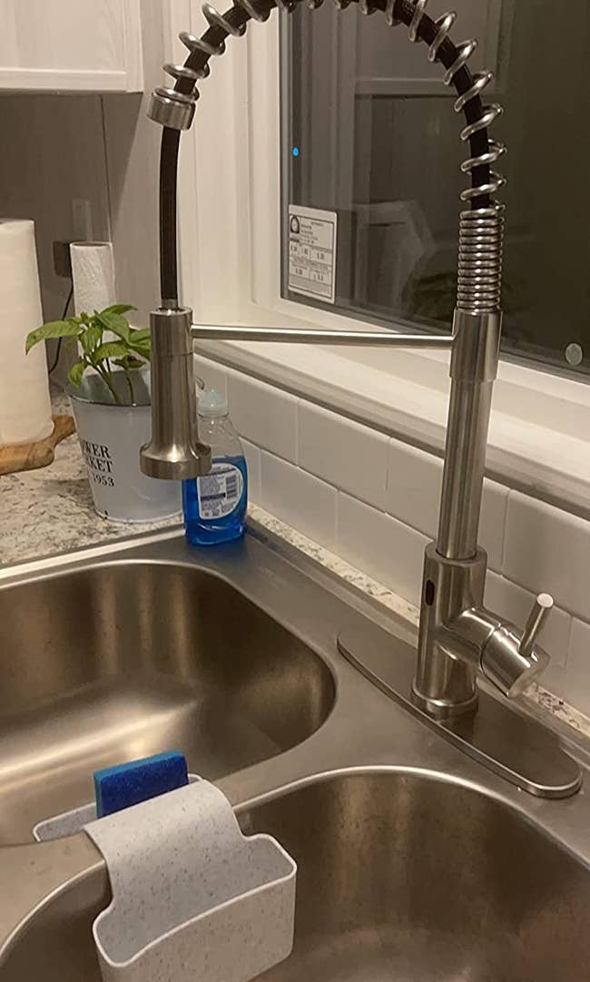 A reviewer's silver faucet with goose neck 