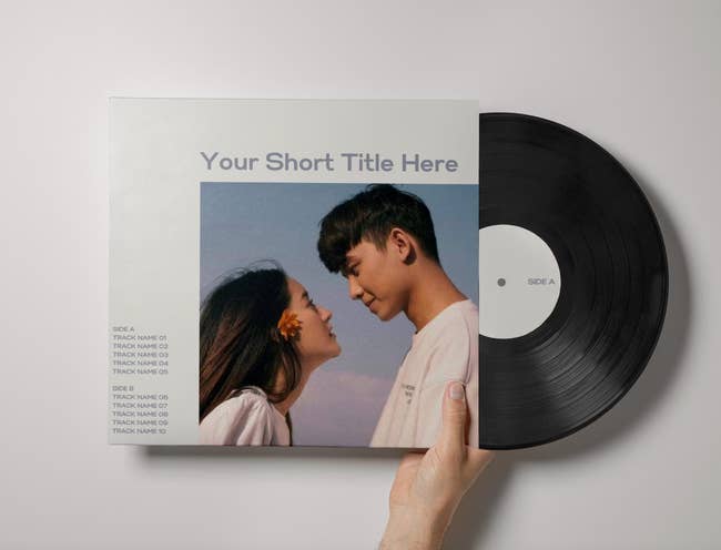 A vinyl in a sleeve that has a spot for a picture of a couple, a title, and a tracklist 