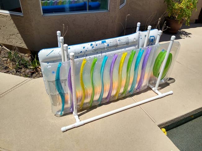PVC pipe organizer to hold long pool rafts