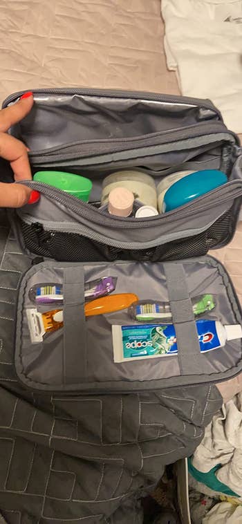 two toothbrushes in a reviewer's toiletry bag