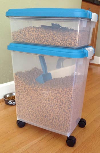 the two-compartment food storage containers filled with dry pet food