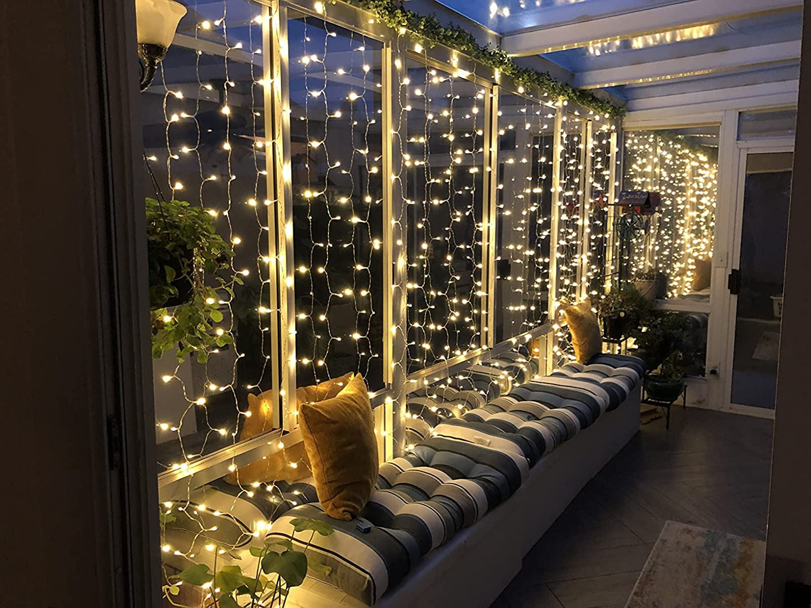 A reviewer shows the lights on thier patio