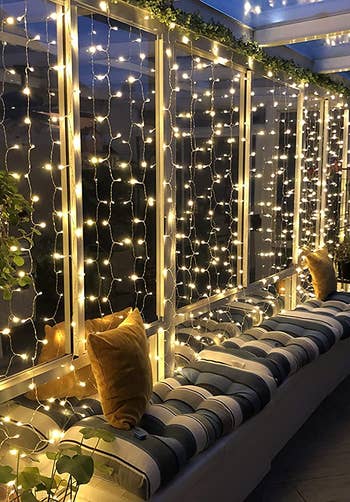 A reviewer shows the lights on thier patio