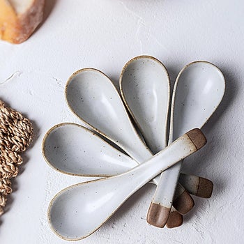 Five ceramic soup spoons