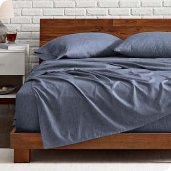 the dark blue flannel sheets and pillowcases on a bed