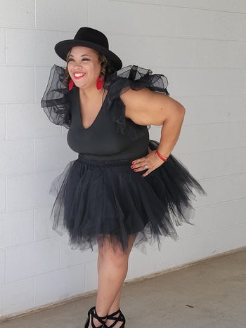 a reviewer wearing the top in black