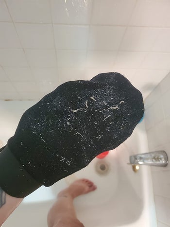 a different reviewer wearing the mitt which is covered in dead skin
