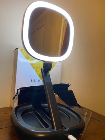 reviewer photo of expanded folding lighted mirror