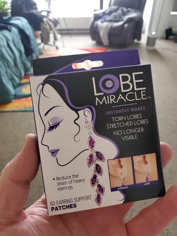 reviewer holding the box of lobe miracles