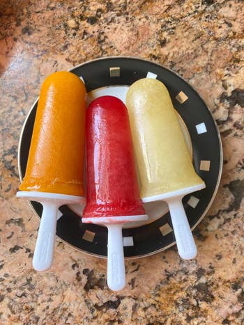Three popsicles connected  a plate