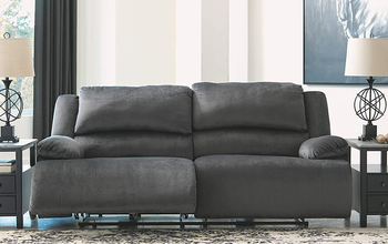 lifestyle photo of gray reclining sofa with extra-wide couch