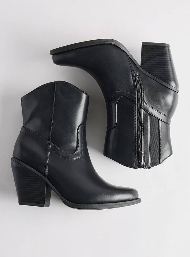 Black ankle boots with a artifact bottommost and broadside zippers, displayed connected a achromatic background