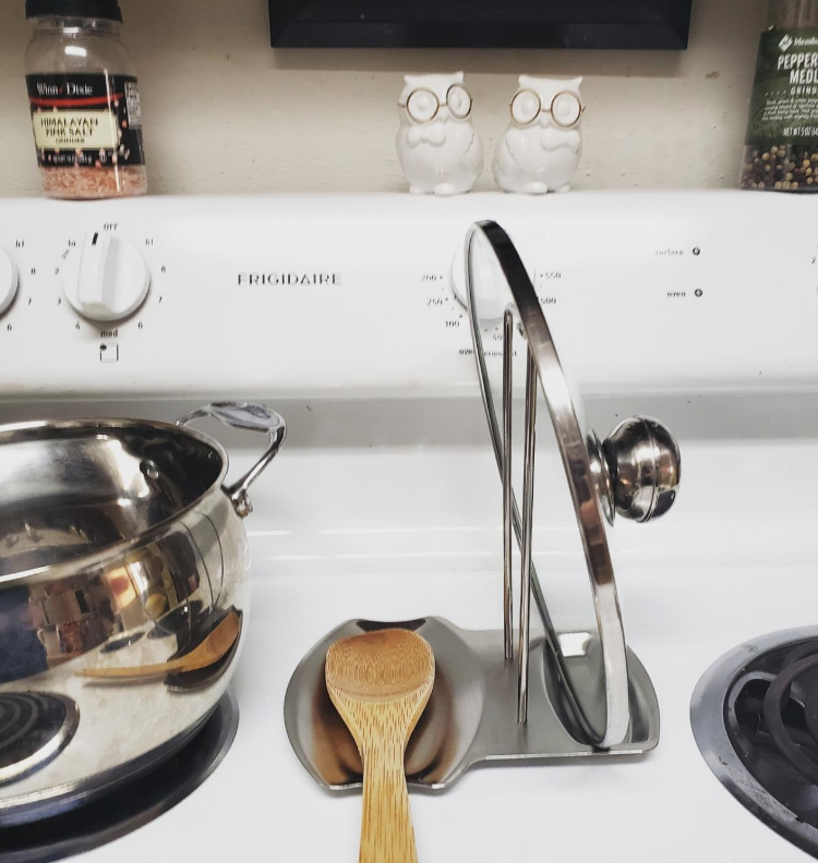 reviewer image of stand holding wooden spoon and top of pan