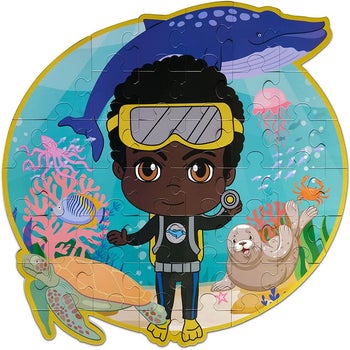 a puzzle depicting a young boy underwater with marine life 