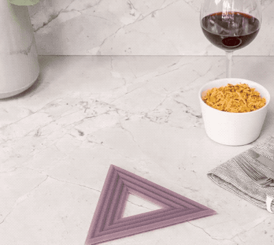 purple triangular trivets holding pots and pans