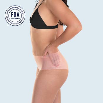Model wearing pink latex underwear