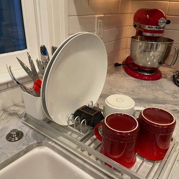 reviewer photo of dishes in sinkside dish rack